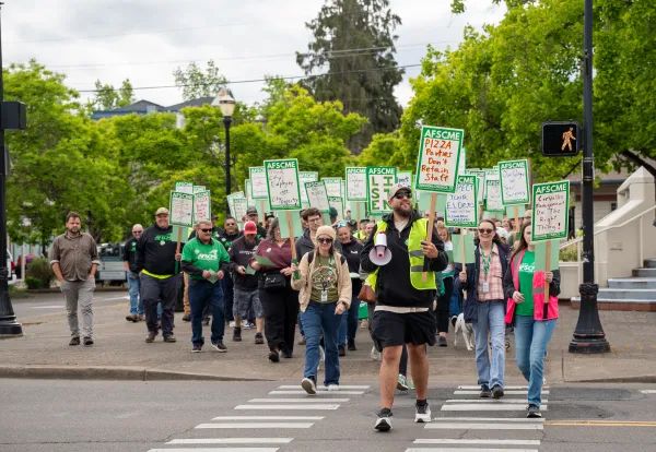 Members marching across a street